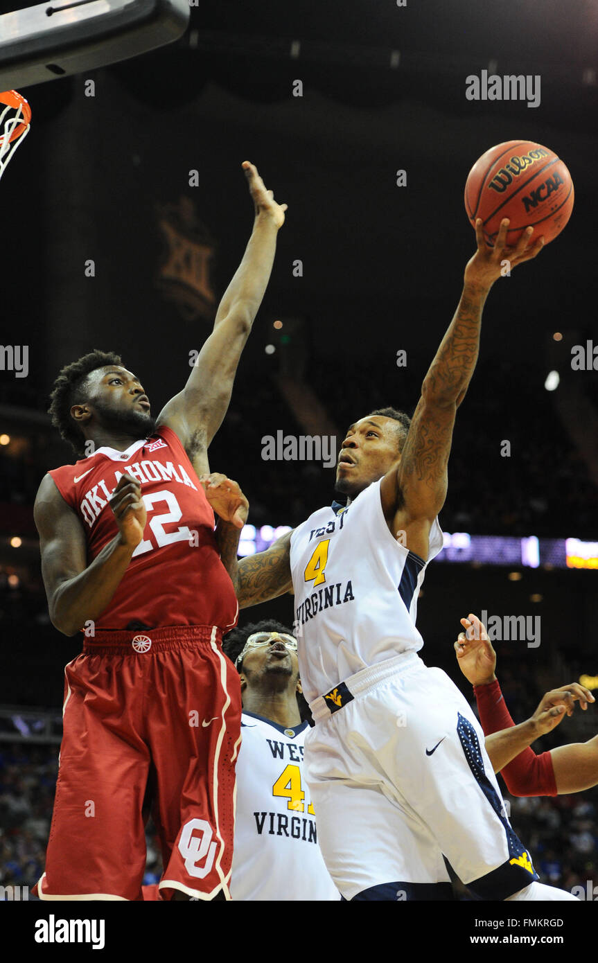 Kansas City, Missouri, USA. 11th Mar, 2016. West Virginia Mountaineers guard Daxter Miles Jr. (4) shoots the ball over Oklahoma Sooners forward Khadeem Lattin (12) during the NCAA Big 12 Championship Men's Basketball semi-final game between the Oklahoma Sooners and the West Virginia Mountaineers at the Sprint Center in Kansas City, Missouri. Kendall Shaw/CSM/Alamy Live News Stock Photo