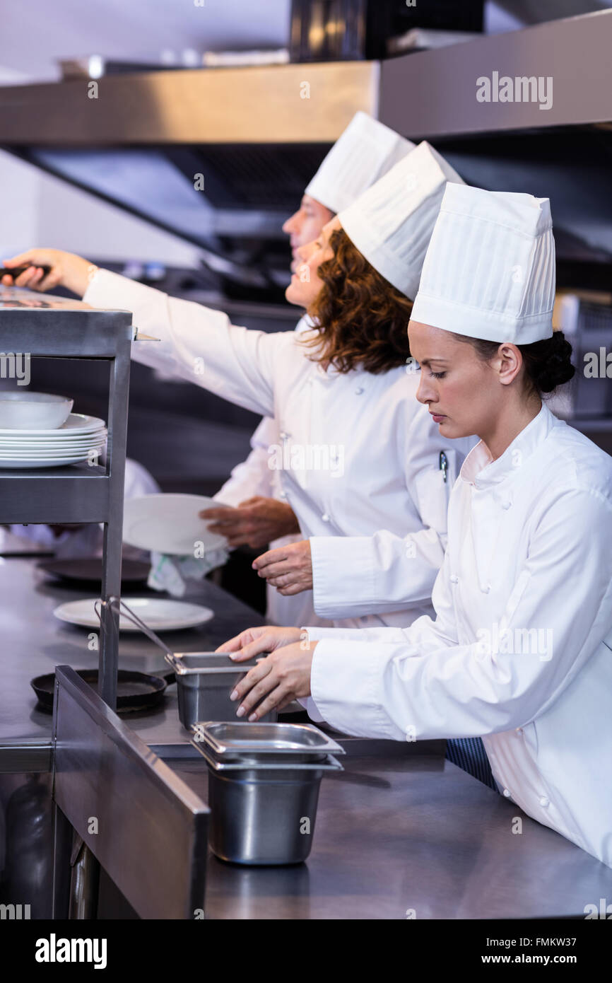 Two chefs working at order station in a kitchen Stock Photo Alamy