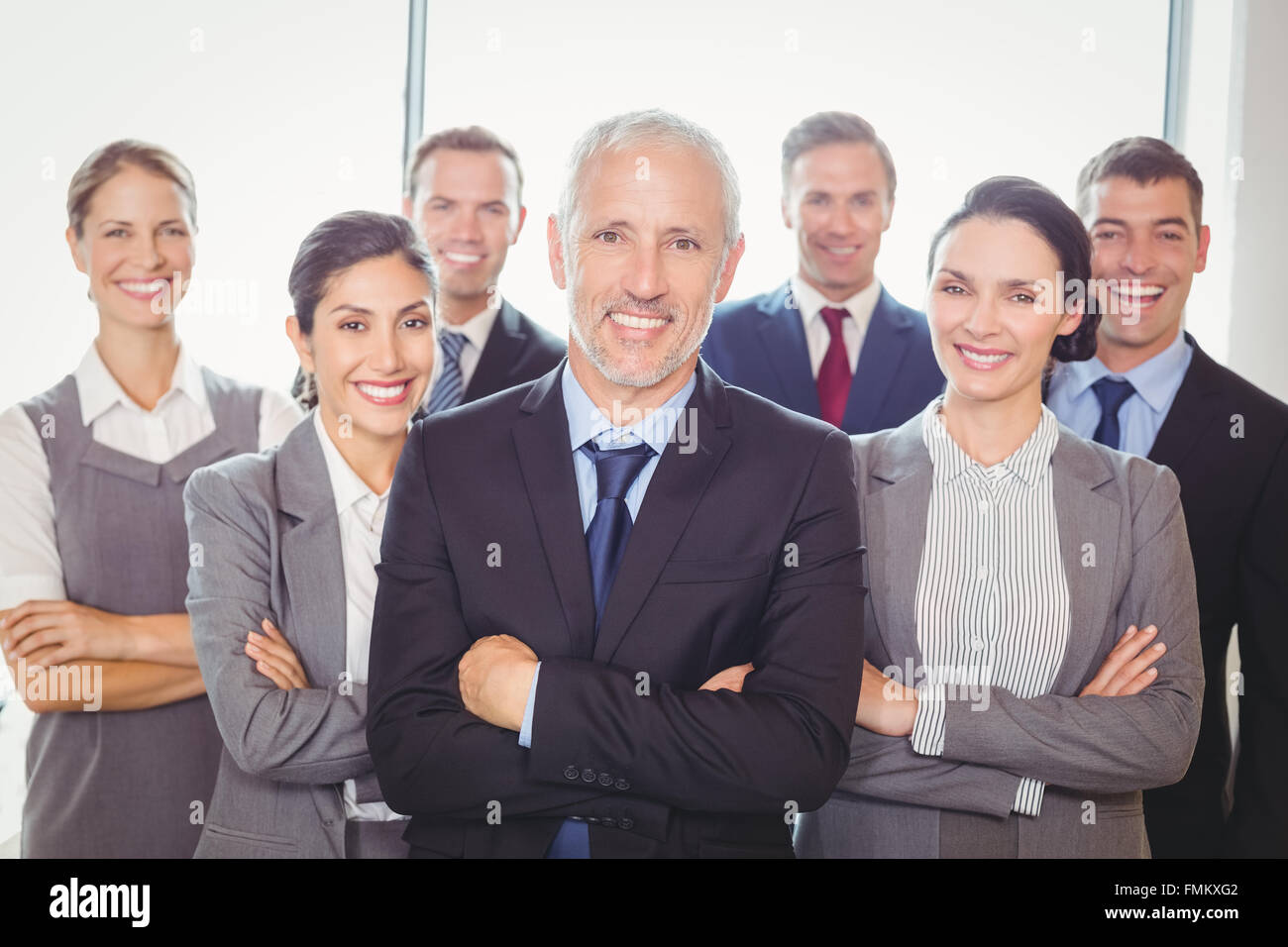 Team of businesspeople posing together Stock Photo - Alamy