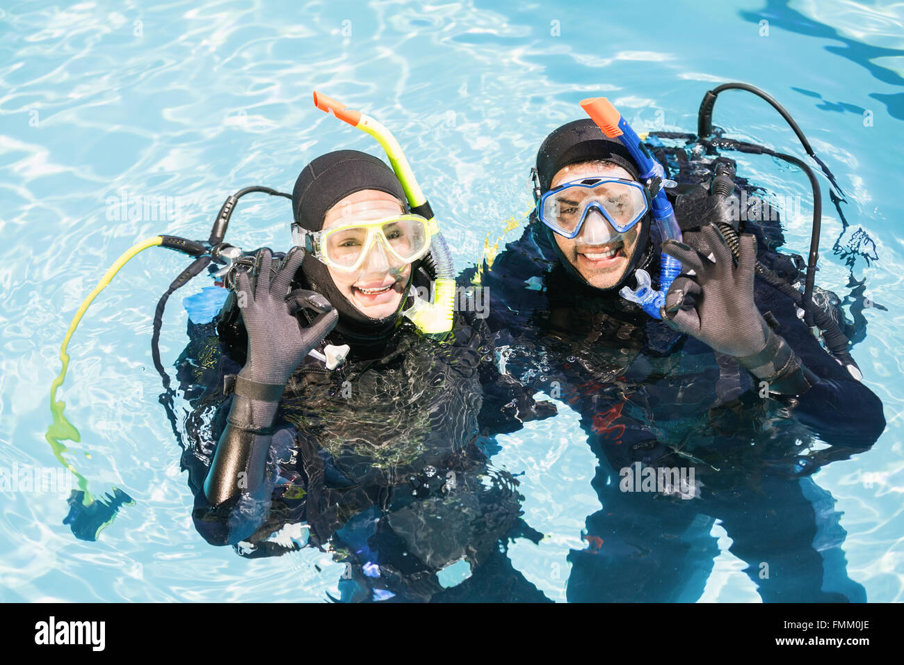 Couple practicing scuba diving together Stock Photo