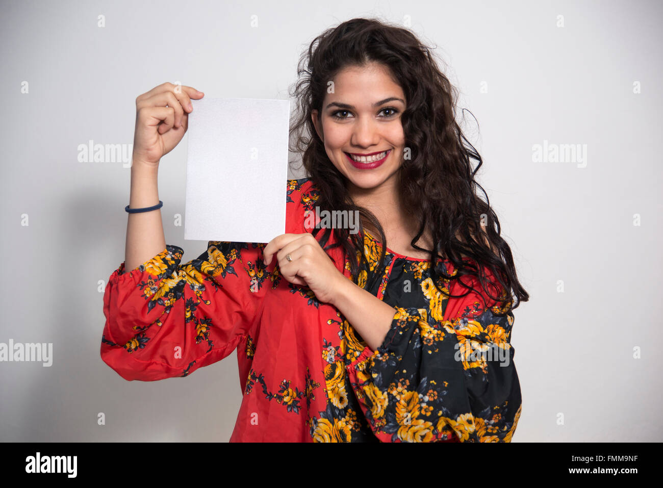 Portrait of a Latin woman with sign Stock Photo - Alamy