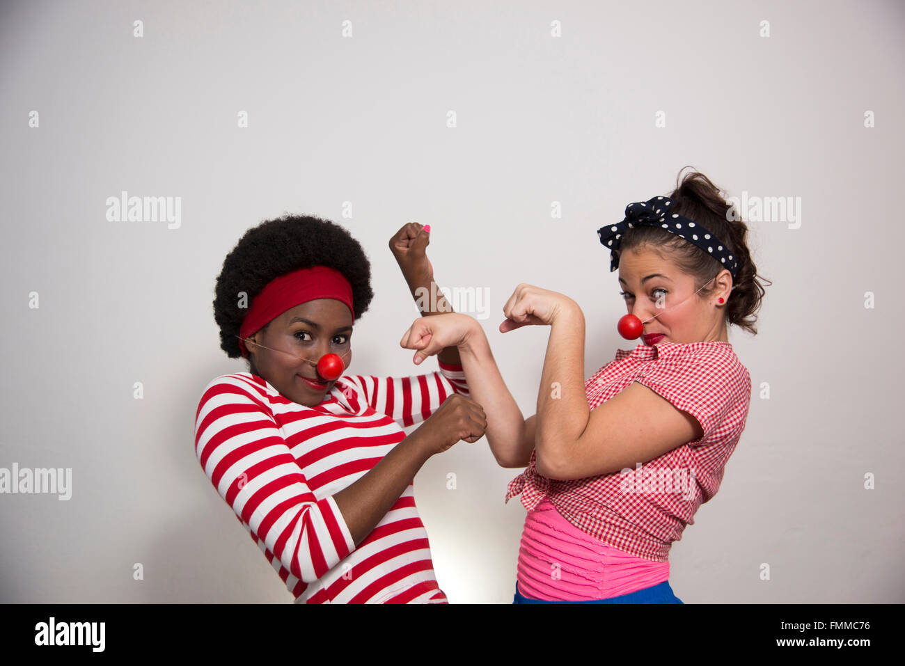 Two female clowns performing Stock Photo - Alamy