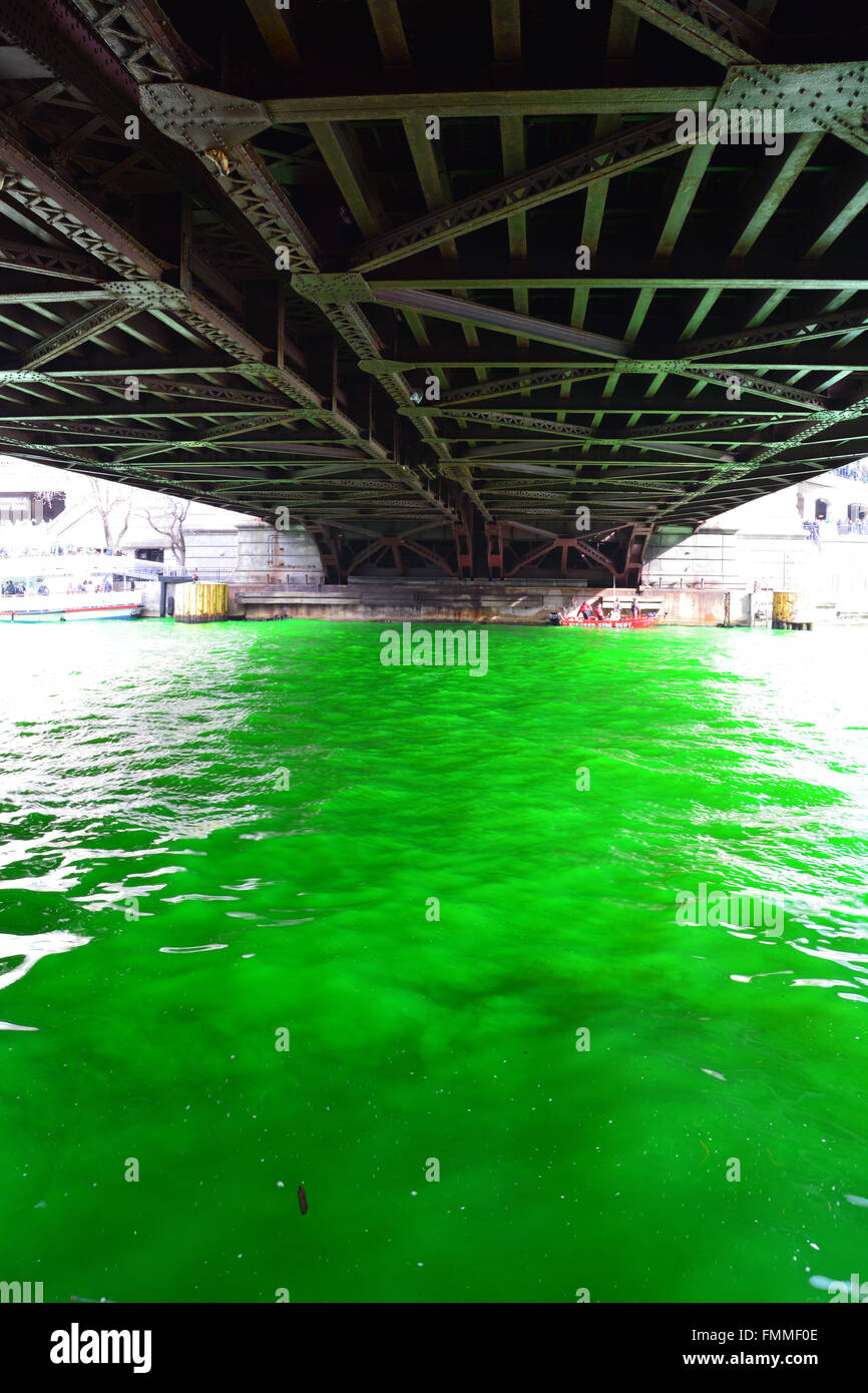 Light reflects off the underside of the bridge during the annual dying the Chicago River green for St. Patrick's Day, 3/12/2016 Stock Photo