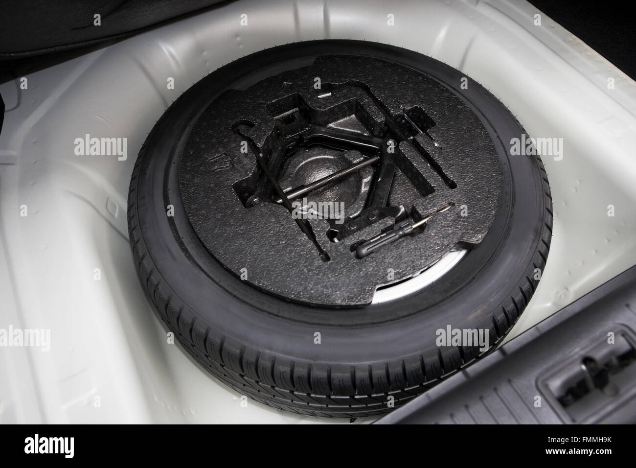 spare tire in the trunk of a modern car Stock Photo Alamy