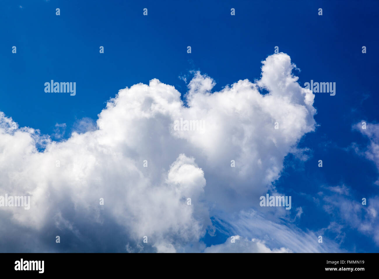 White fluffy clouds in blue sky Stock Photo - Alamy