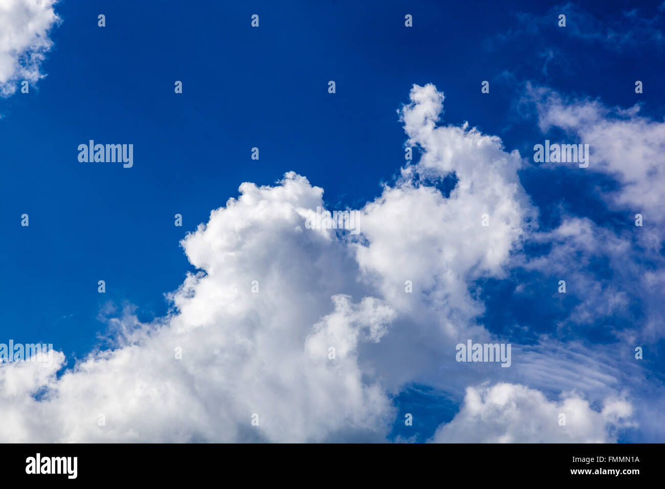 White fluffy clouds in blue sky Stock Photo - Alamy
