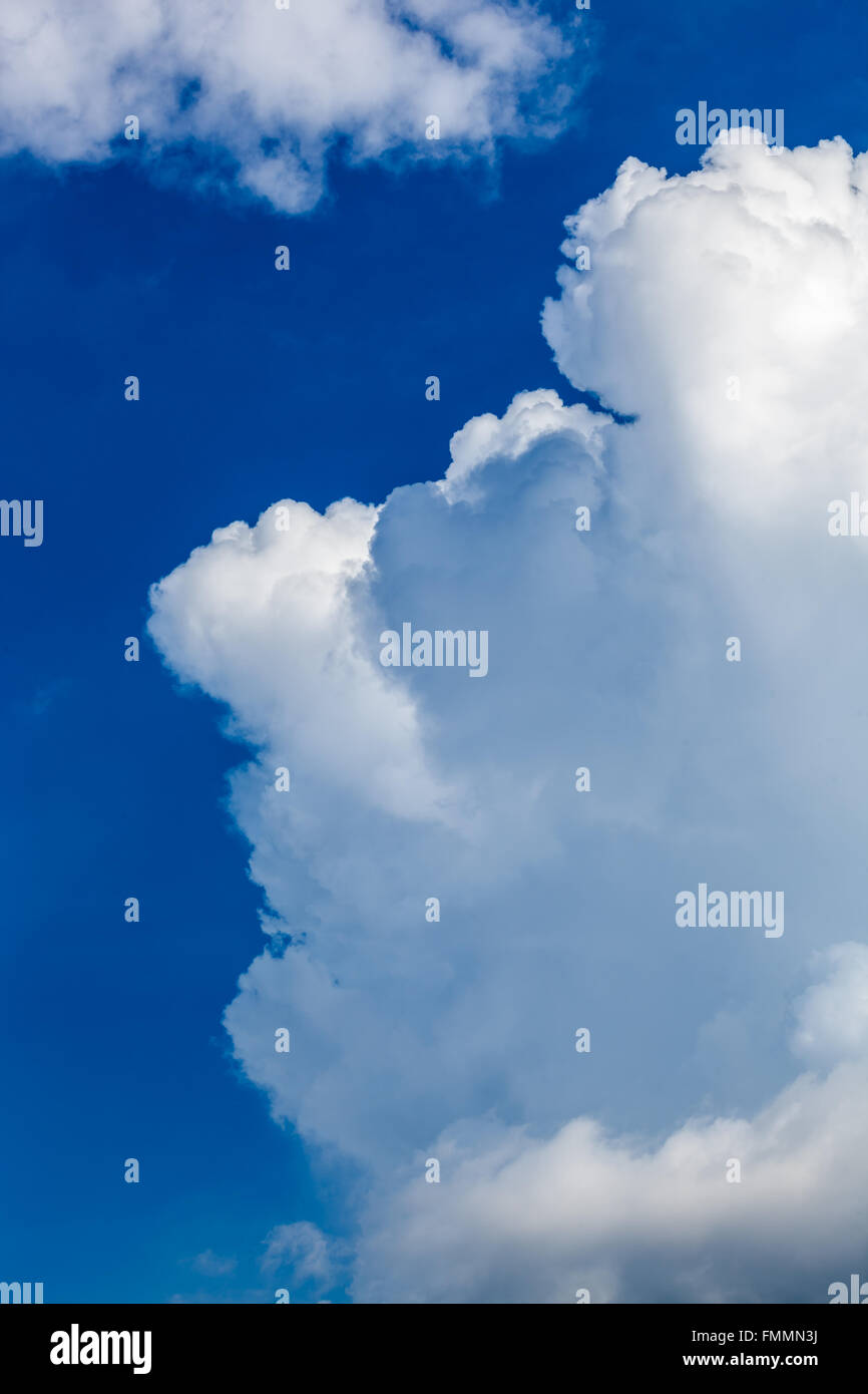 White fluffy clouds in blue sky Stock Photo - Alamy