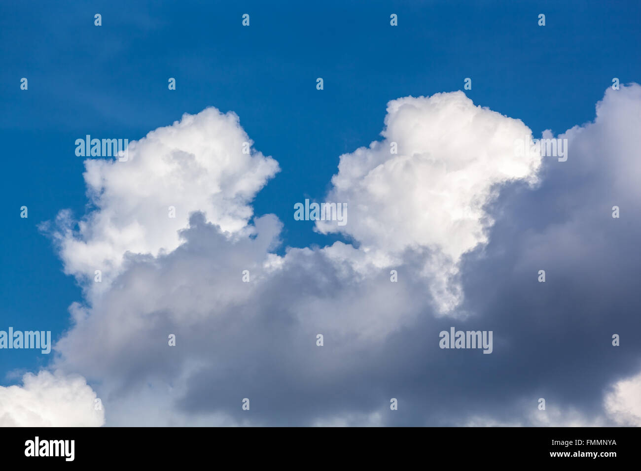 White fluffy clouds in blue sky Stock Photo - Alamy