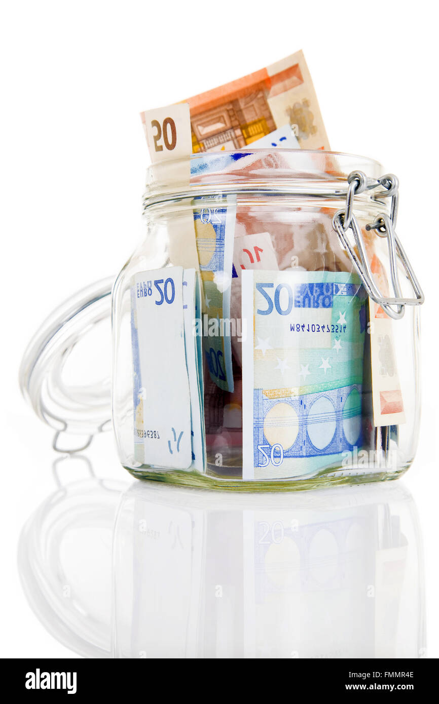 Glass money jar of Euro banknotes Stock Photo - Alamy
