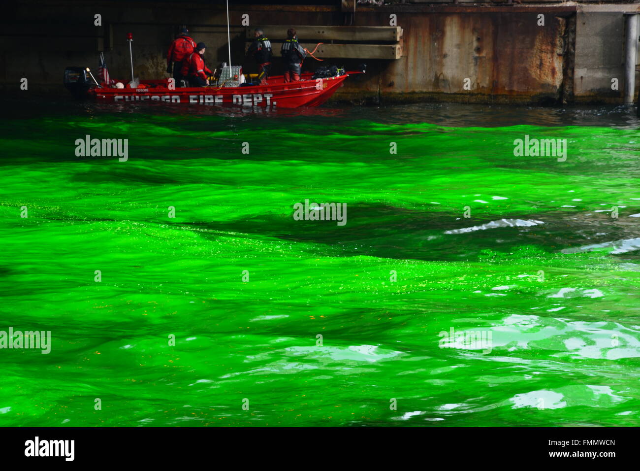 The Chicago Fire Dept divers are near during the annual dying the Chicago River green for St. Patrick's Day, 3/12/2016 Stock Photo