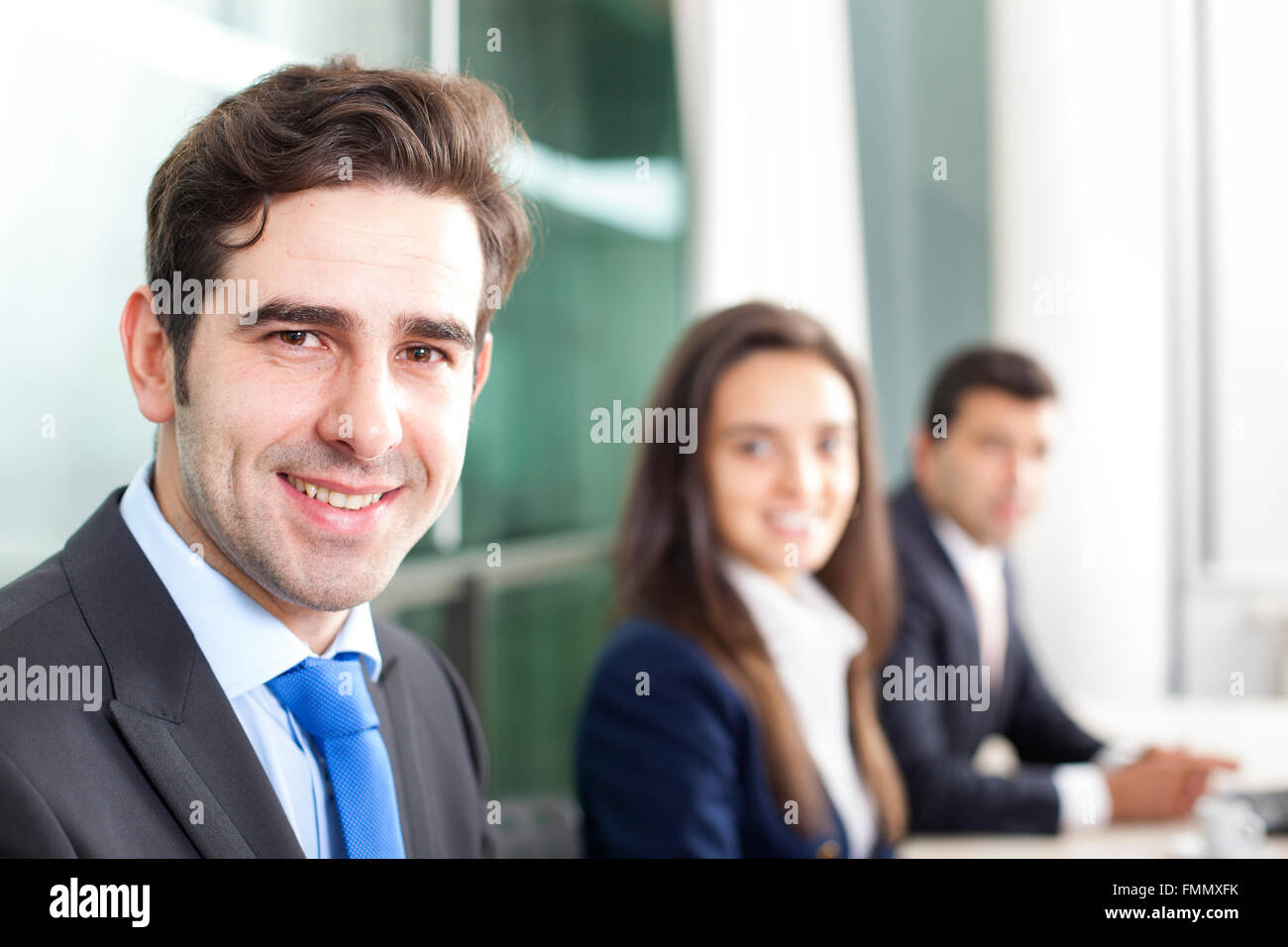 Business team smiling at the office, lined up Stock Photo - Alamy