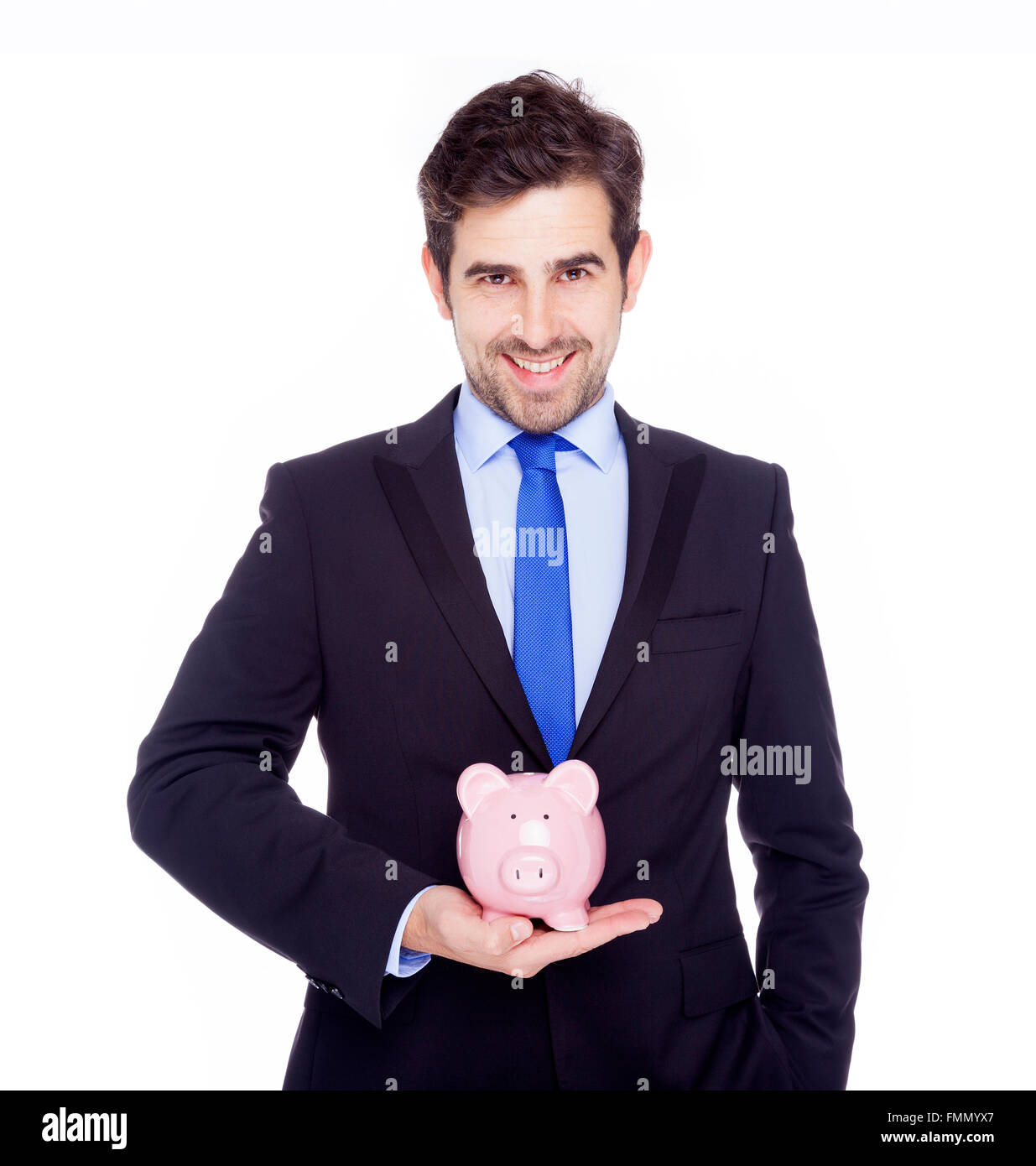 Handsome businessman holding a piggy bank, isolated on a white ...