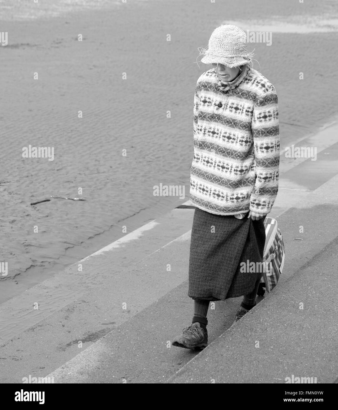 Beach bag lady in Burnham on sea in Somerset, 12th March 2016 Stock Photo