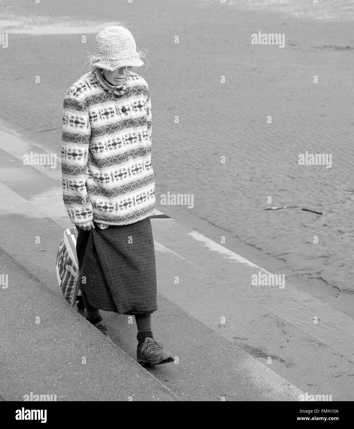 Beach bag lady in Burnham on sea in Somerset, 12th March 2016 Stock Photo