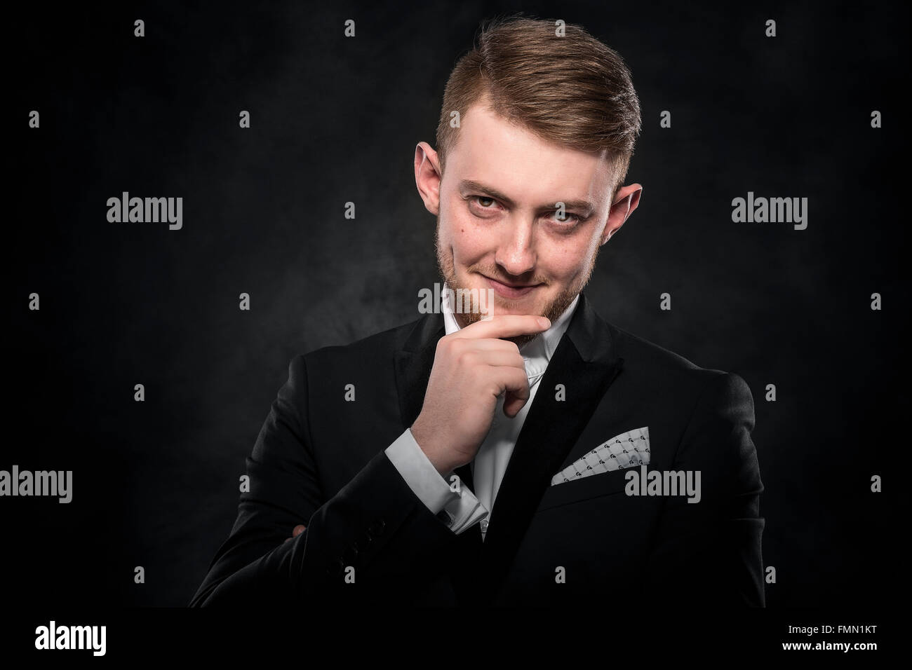 Young handsome man in black suit Stock Photo - Alamy