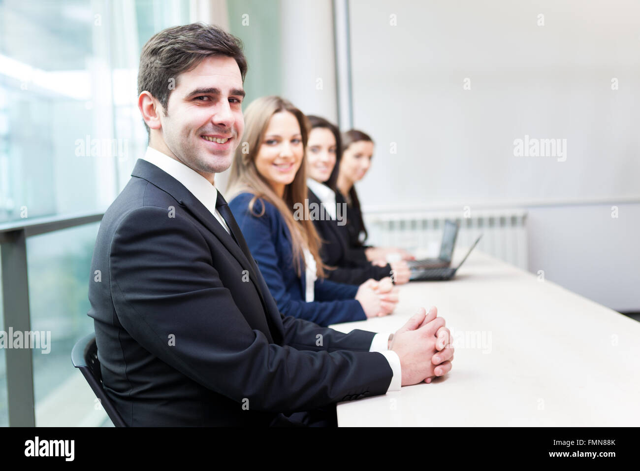 Group of business people smiling at the office lined up Stock Photo - Alamy
