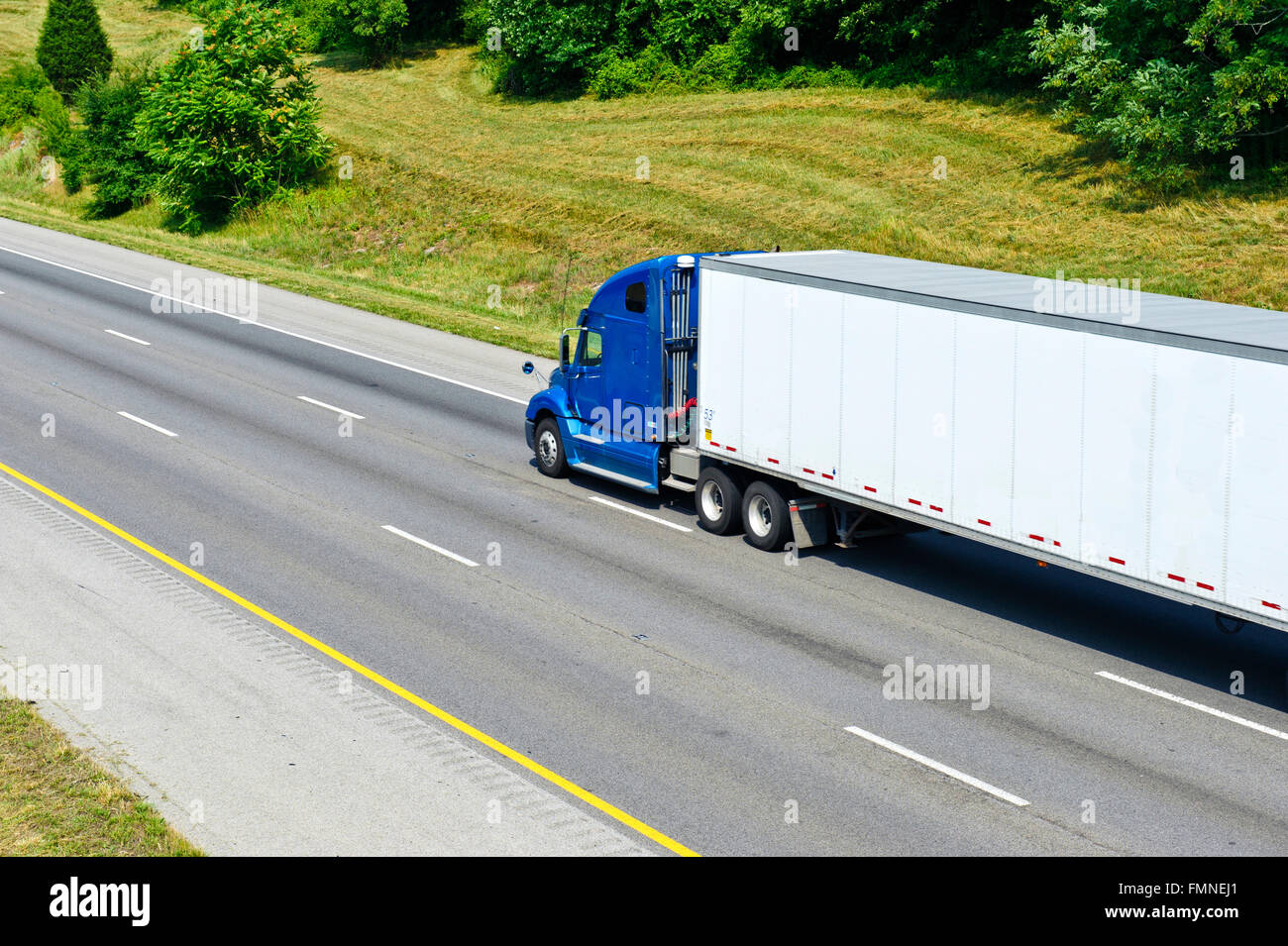 Single Blue Semi Truck On Interstate Highway Stock Photo
