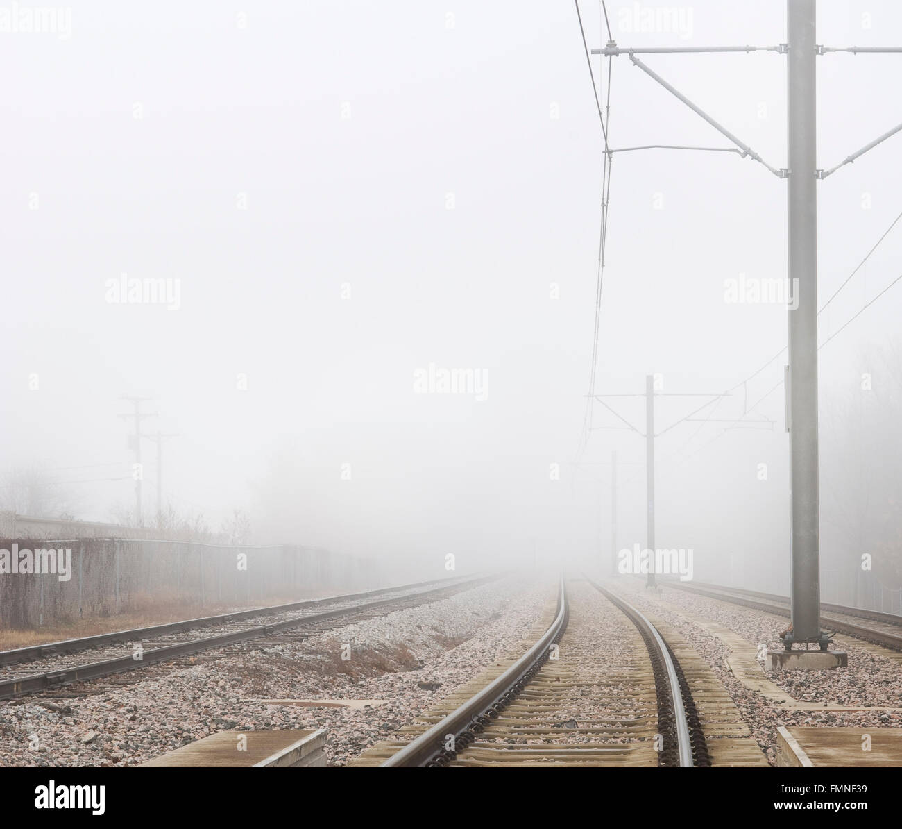 Train Tracks Disappear Into Fog 2 Stock Photo