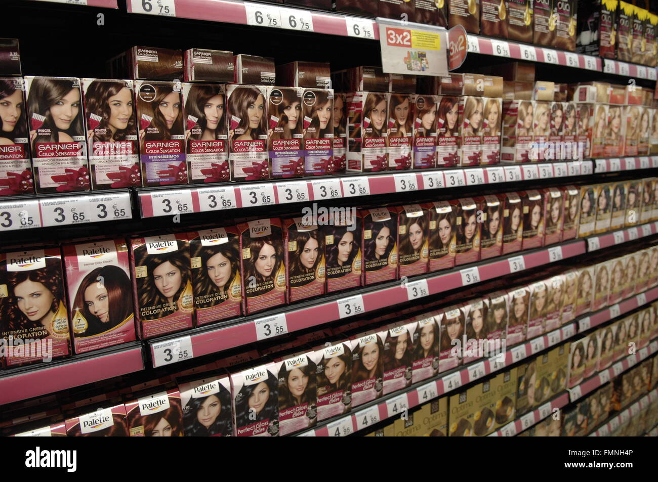 Hair dye on shelfs on display in a shop Stock Photo Alamy