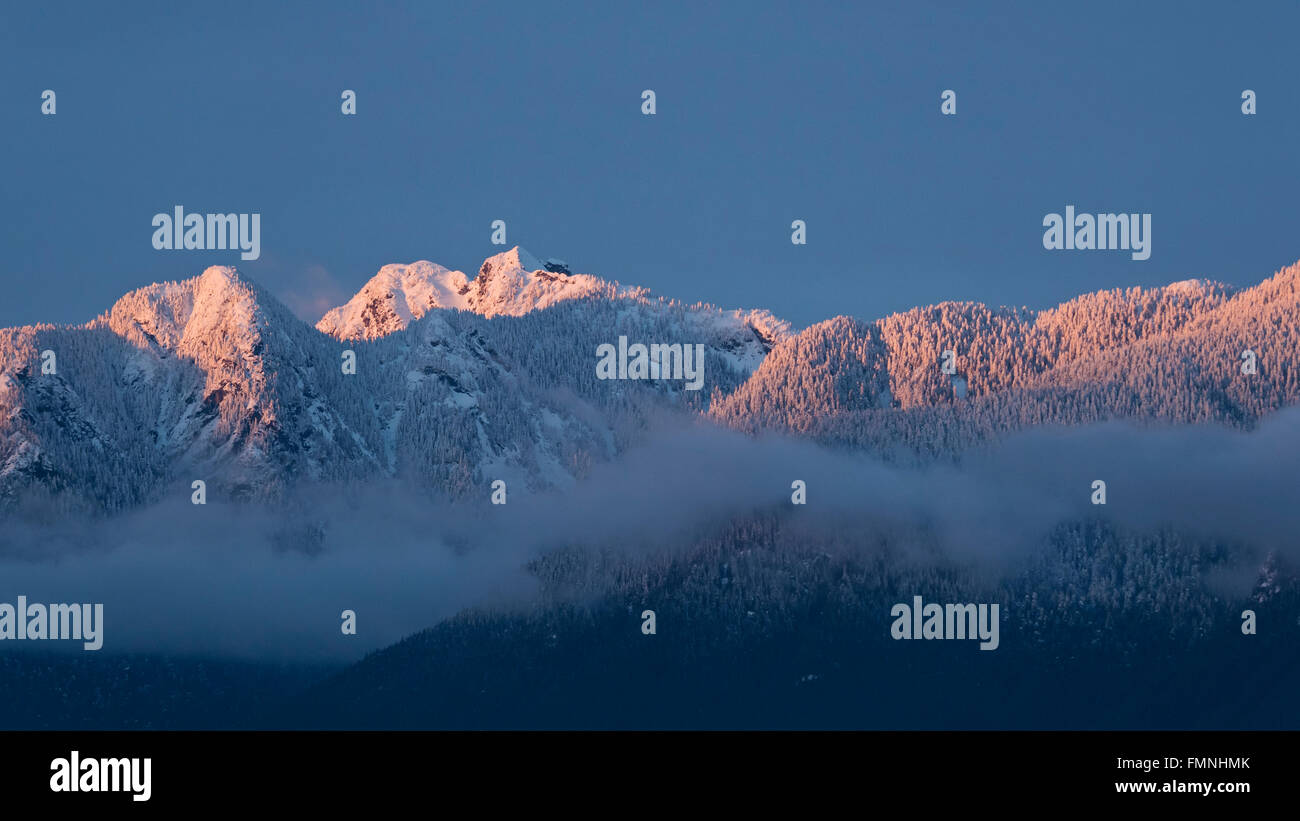 Scenic winter wintry snowy snow capped view North Shore Mountains Vancouver Canada Stock Photo