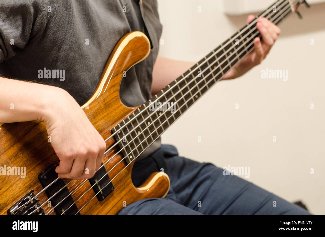 Detail of bass player hands Stock Photo Alamy