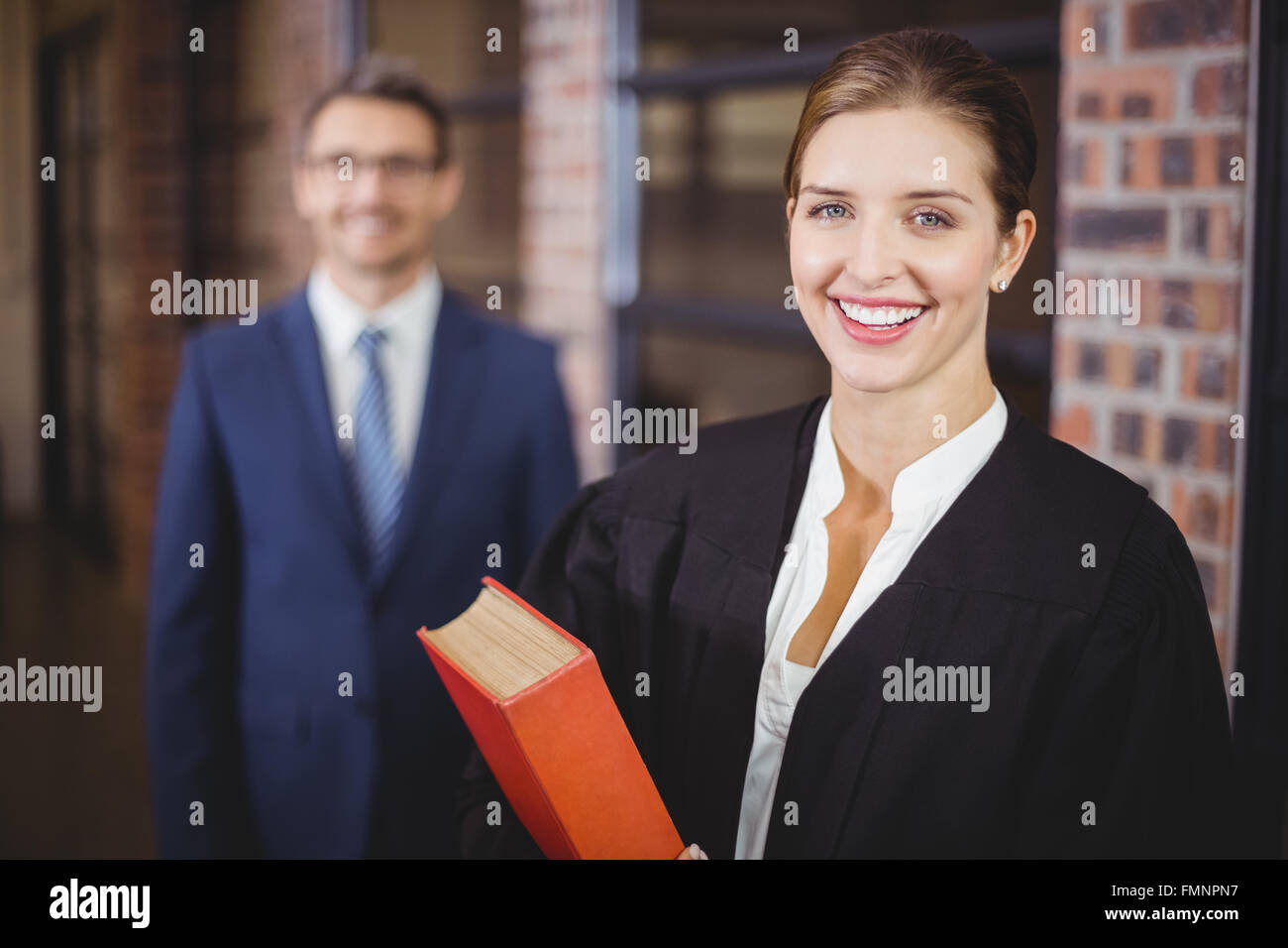 Happy female lawyer with businessman Stock Photo
