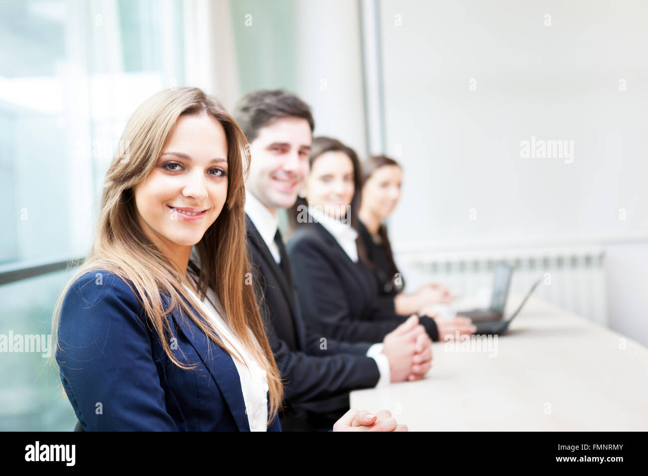 Group of business people smiling at the office lined up Stock Photo - Alamy