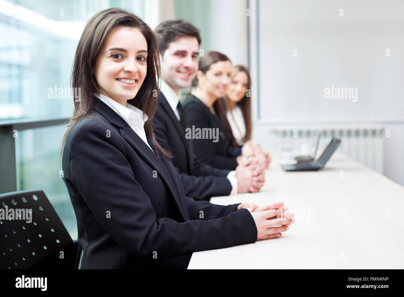 Group of business people smiling at the office lined up Stock Photo - Alamy