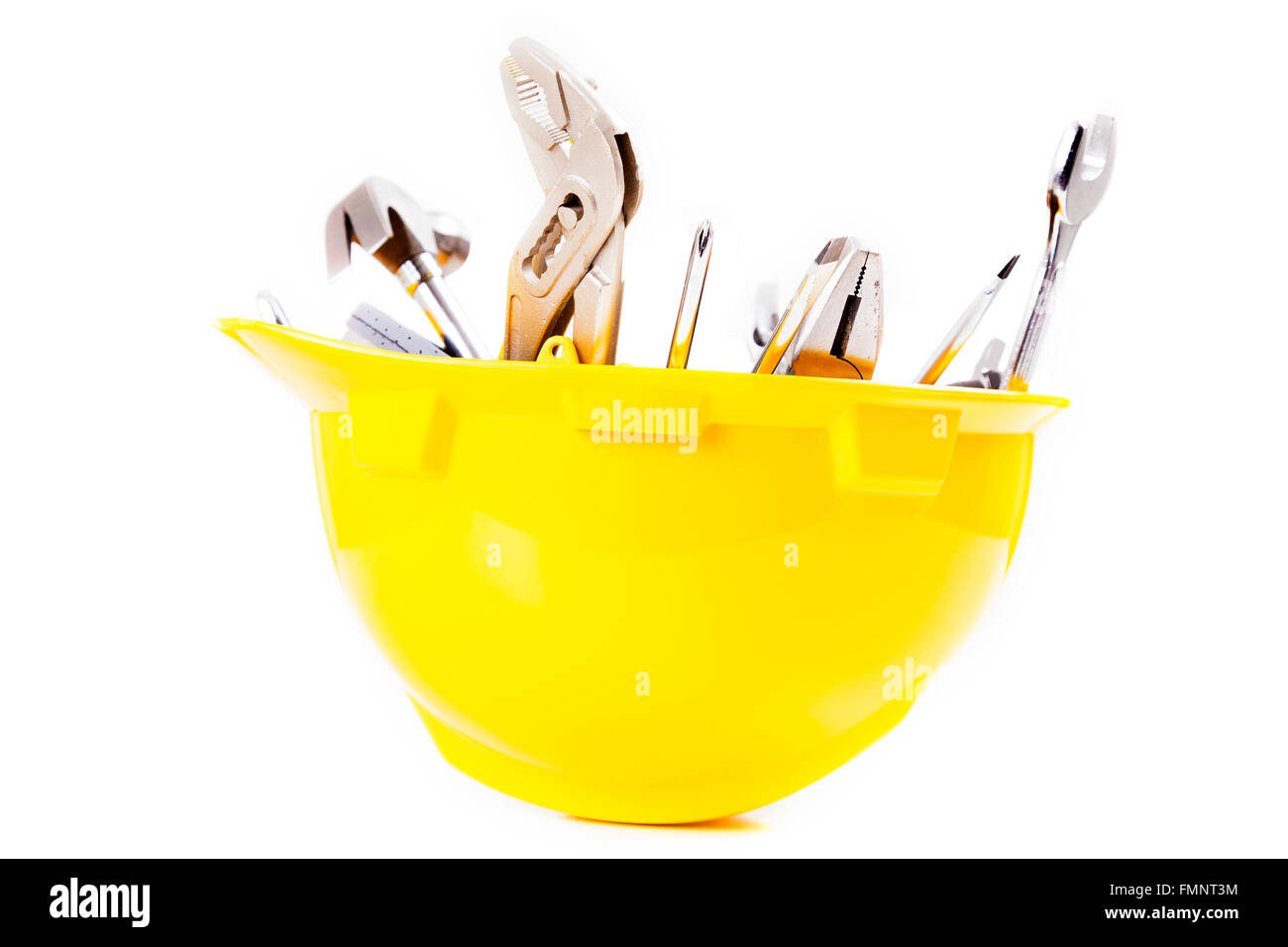 Yellow helmet and tools isolated over white background Stock Photo - Alamy