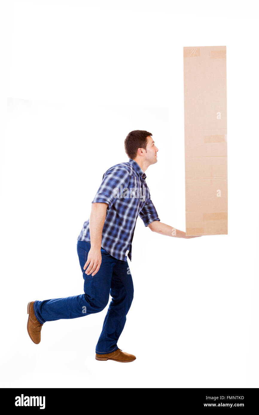 Young man lifting a cardboard box, isolated on white background Stock Photo