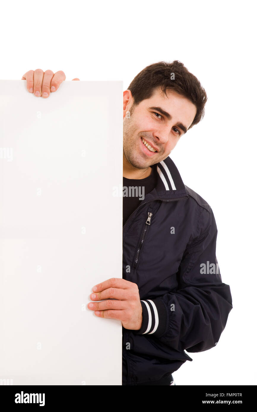 Portrait of a happy handsome young man holding blank white card over ...