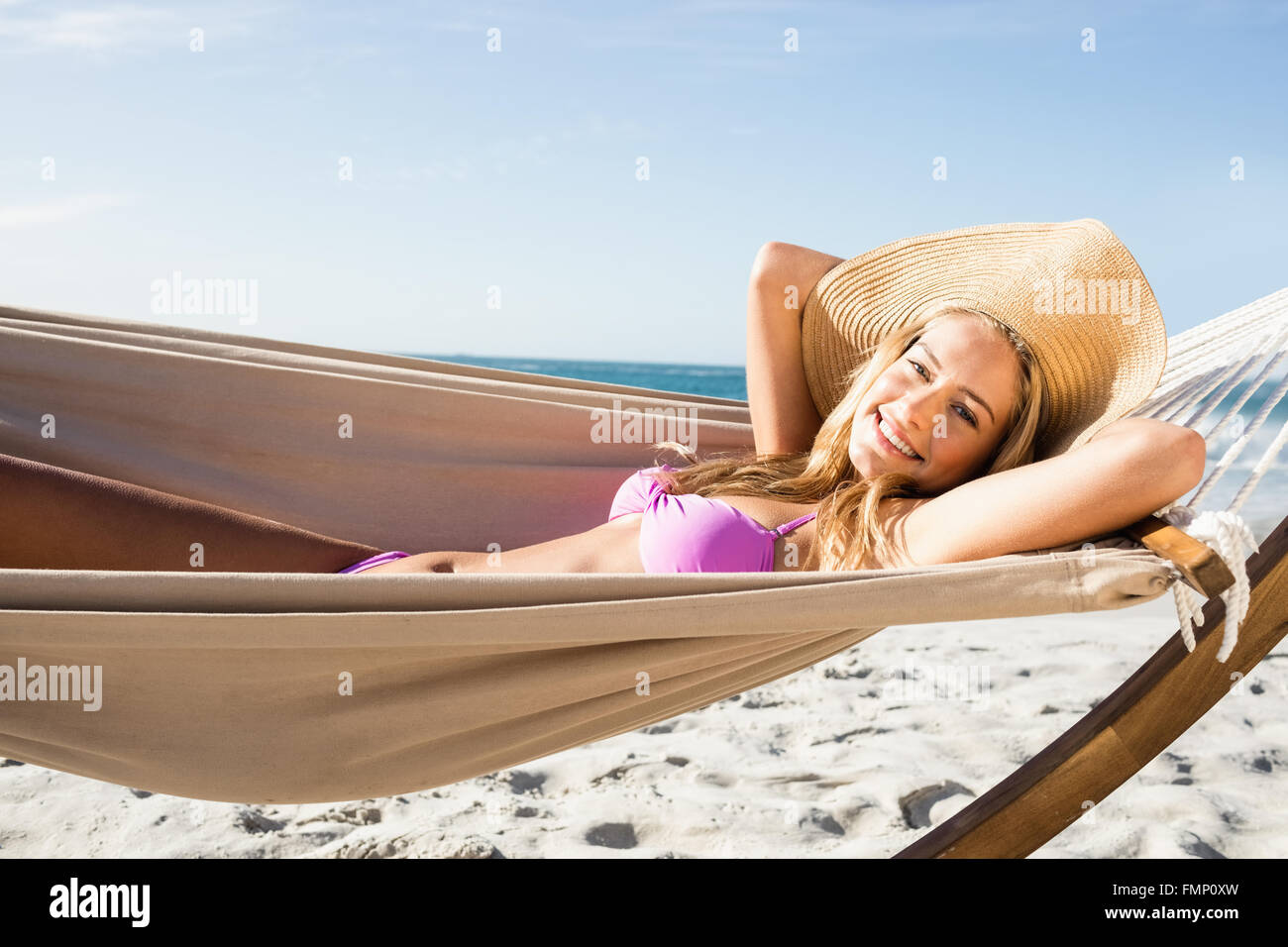 Woman lying in hammock Stock Photo - Alamy