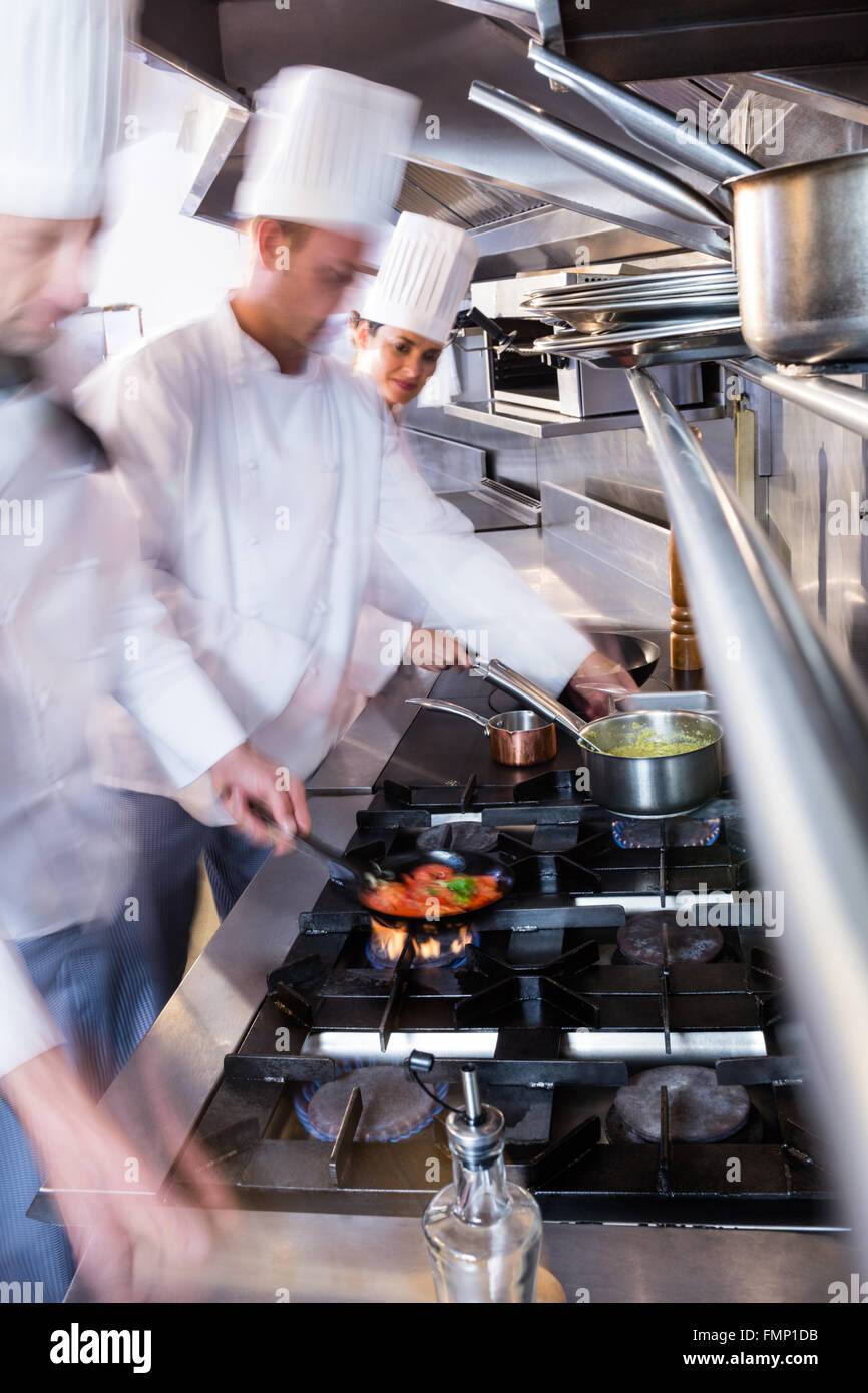 Chefs Preparing Food In The Kitchen Stock Photo - Alamy