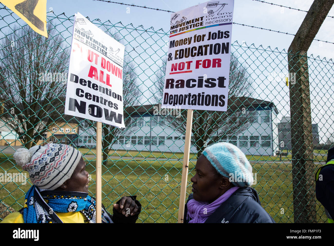 Milton Ernest, UK. 12th March, 2016. Two women holding Movement for Justice placards outside Yarl’s Wood Immigration Removal Centre in Bedfordshire. Credit:  Mark Kerrison/Alamy Live News Stock Photo