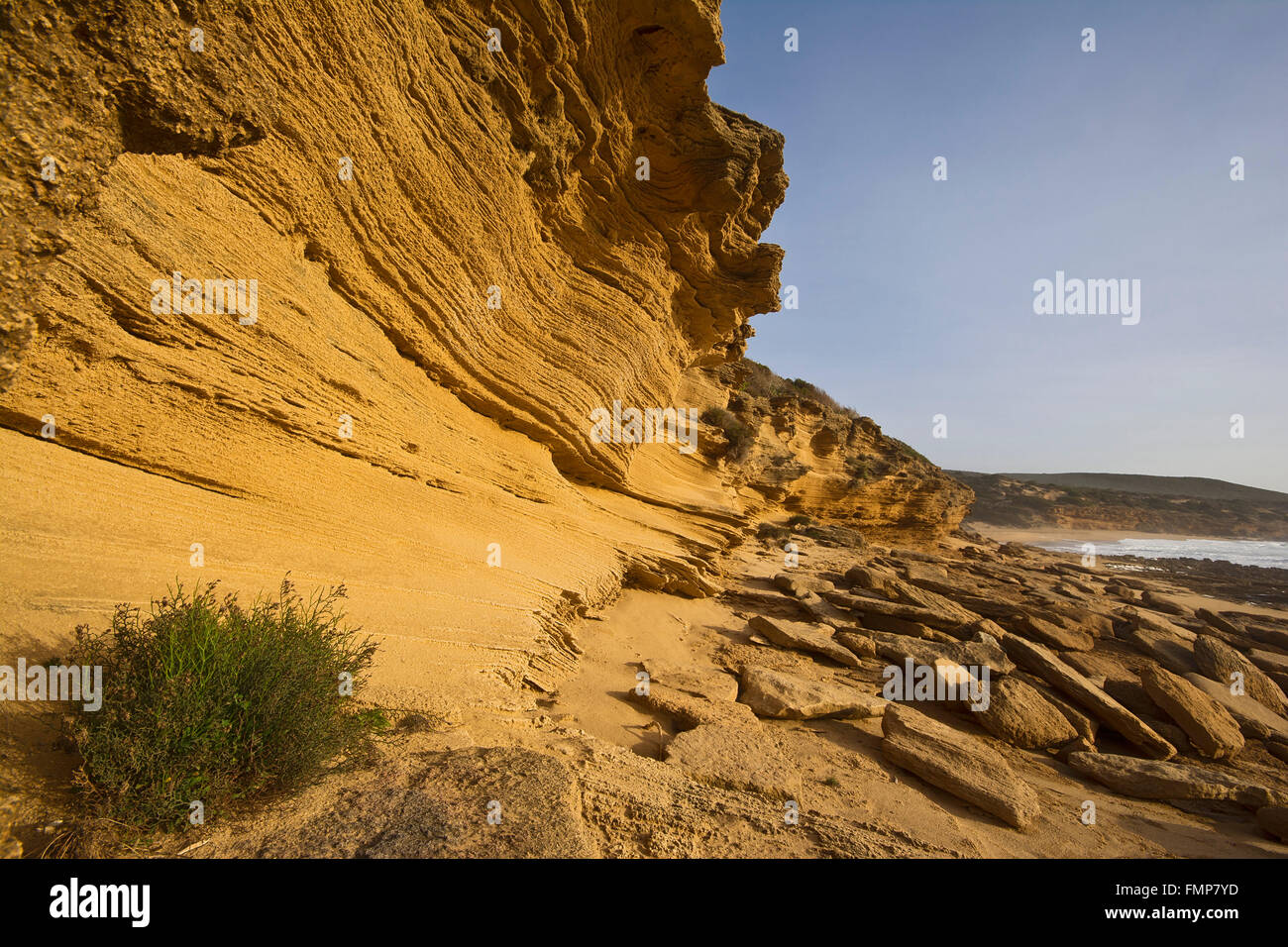 Washed out rock face, rock formation on the beach of Portu Maga, Costa Verde, Sardinia, Italy Stock Photo