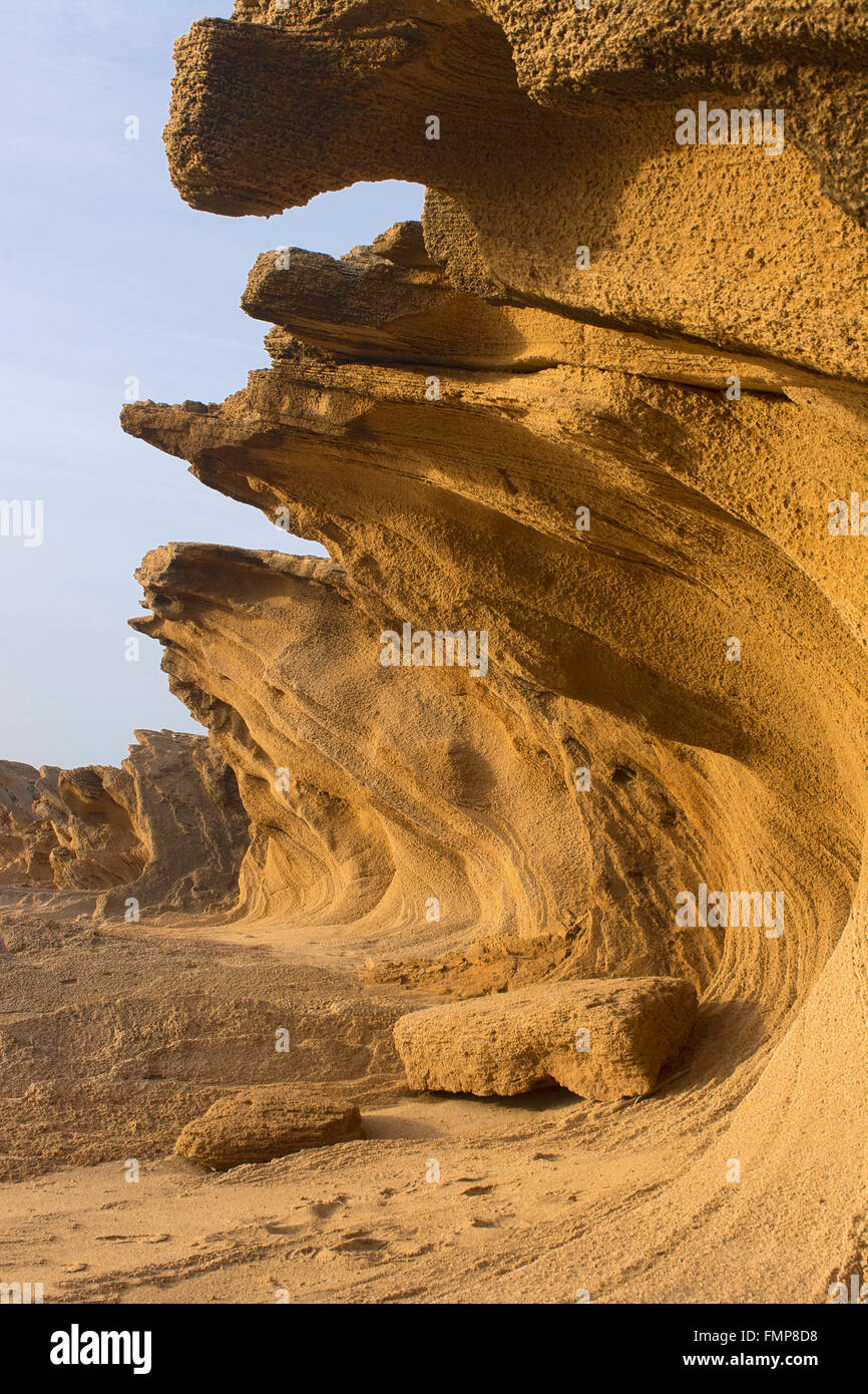 Washed out rock face, rock formation on the beach of Portu Maga, Costa Verde, Sardinia, Italy Stock Photo