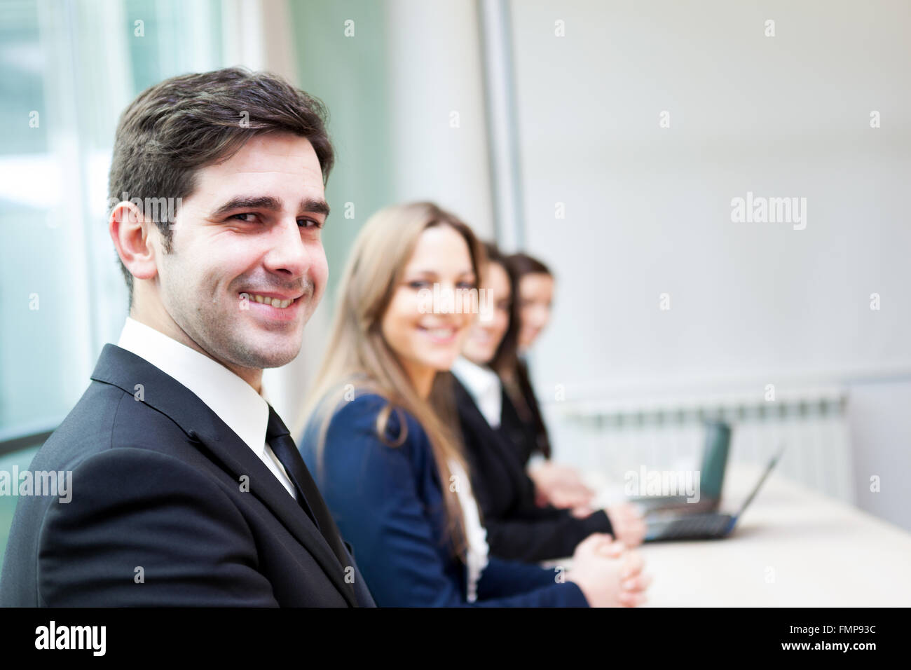 Group of business people smiling at the office lined up Stock Photo - Alamy