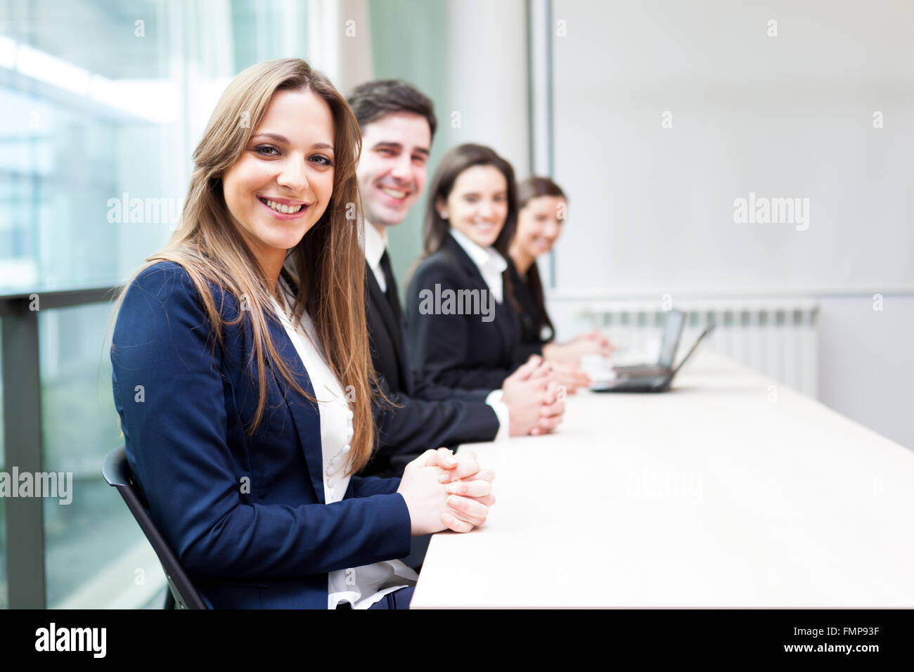 Group of business people smiling at the office lined up Stock Photo - Alamy