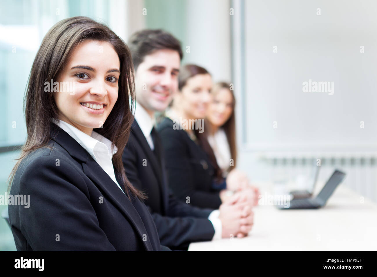 Group of business people smiling at the office lined up Stock Photo - Alamy