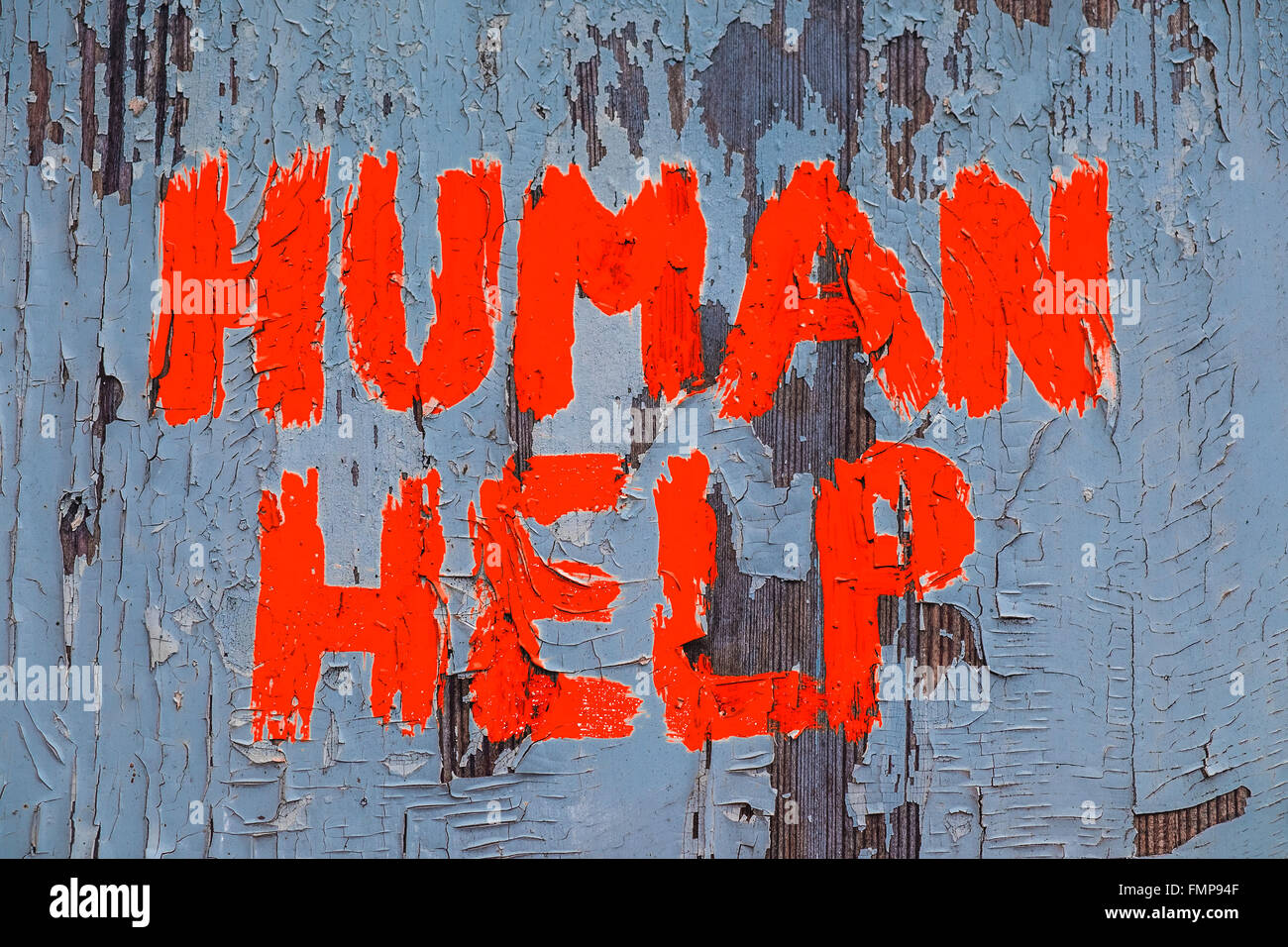 Graffiti reading Human help, calling for humanitarian aid Stock Photo