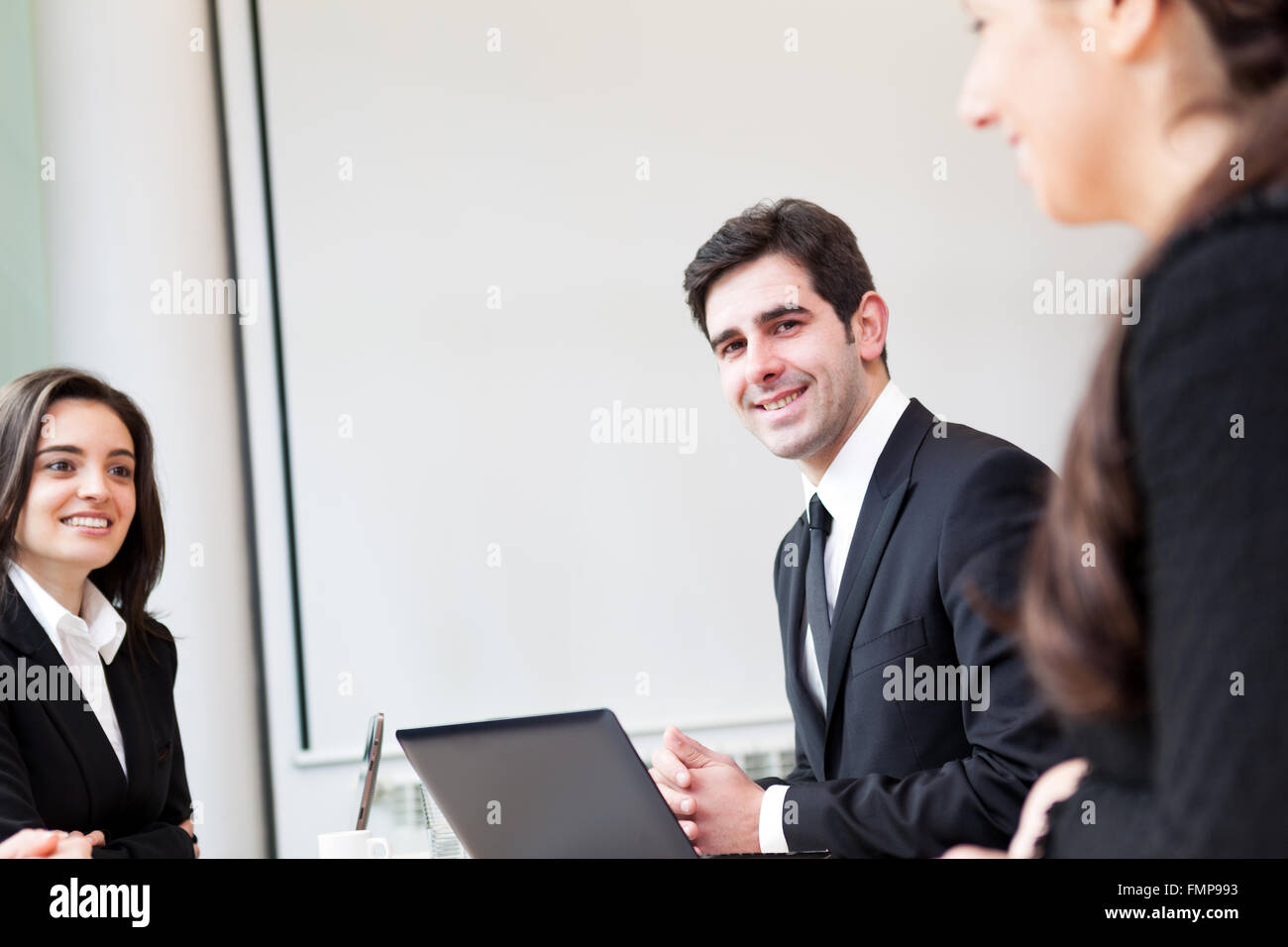 Happy business man smiling at the office Stock Photo - Alamy