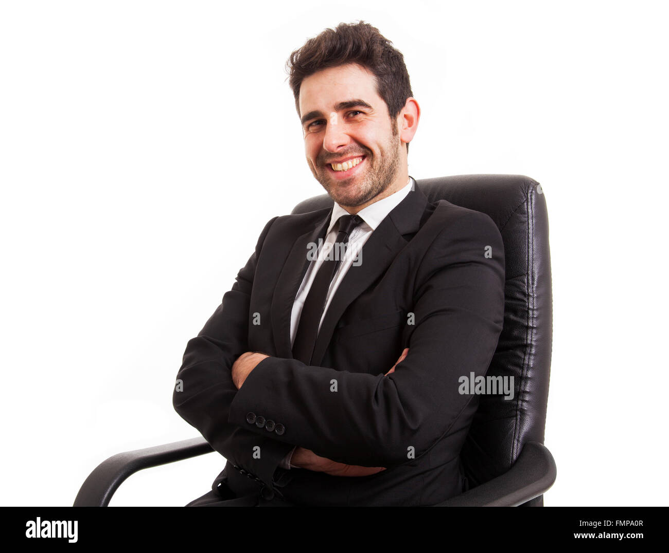 Relaxed business man sits on office chair over white background Stock
