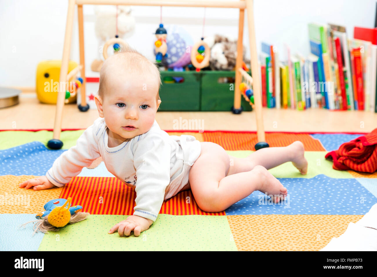 Baby first crawling attempts Stock Photo - Alamy