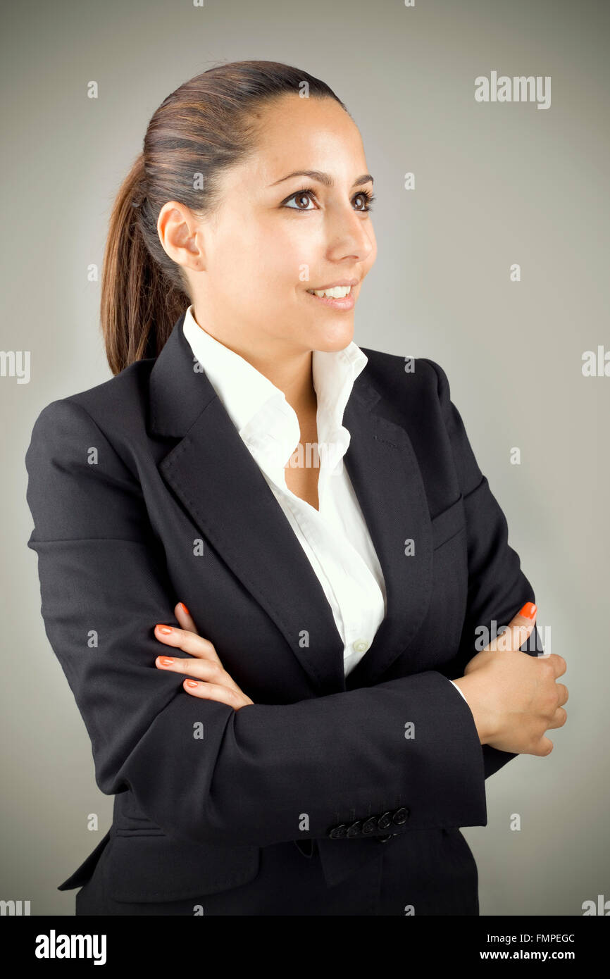 Young business woman on grey background Stock Photo - Alamy
