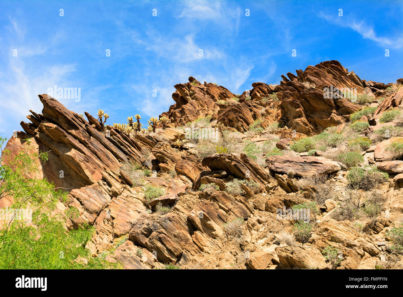 Scenic view of a rugged, rocky mountainside framed against a blue sky. Stock Photo