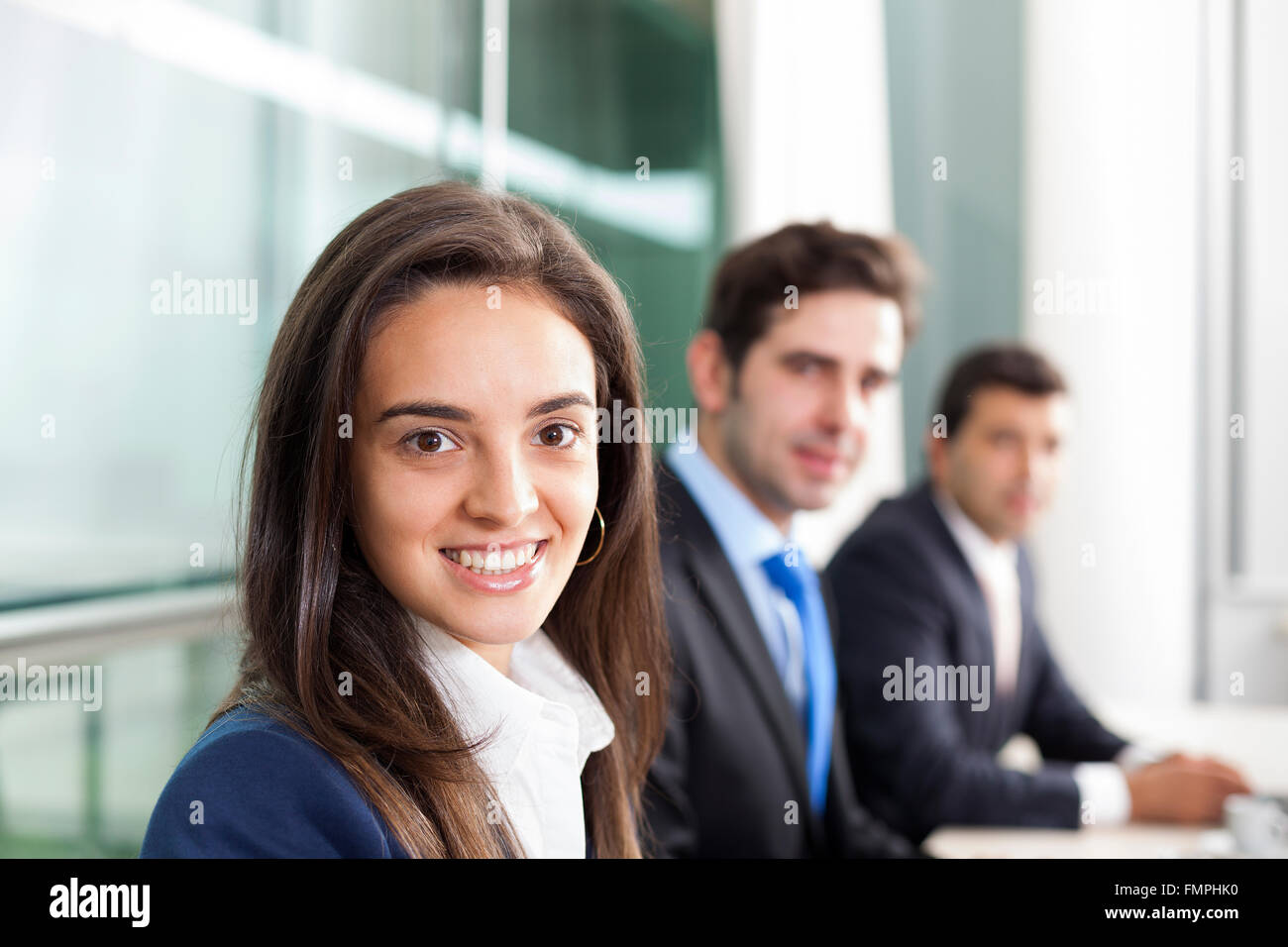 Business team smiling at the office, lined up Stock Photo - Alamy