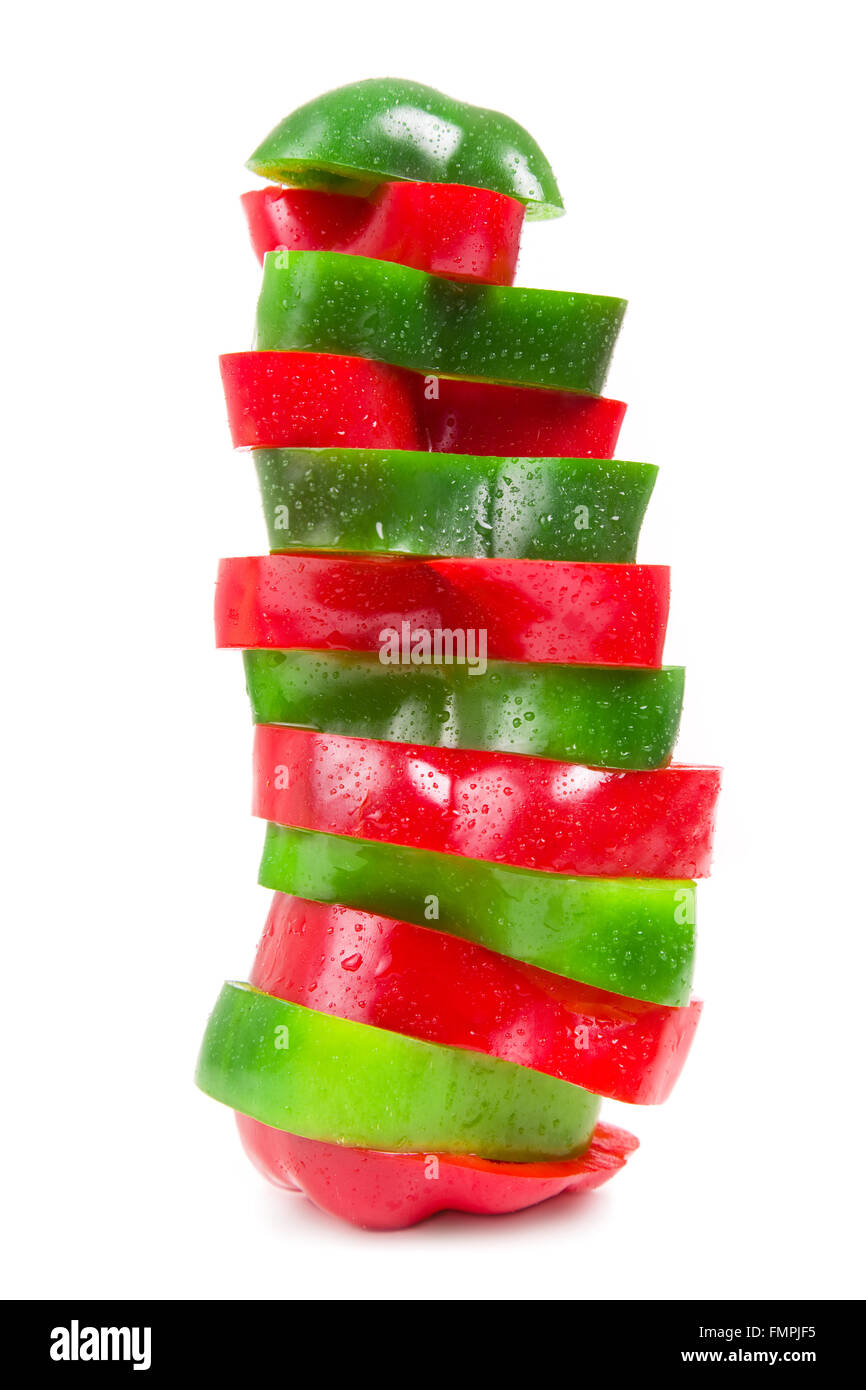 sliced red and green pepper on a white background Stock Photo - Alamy