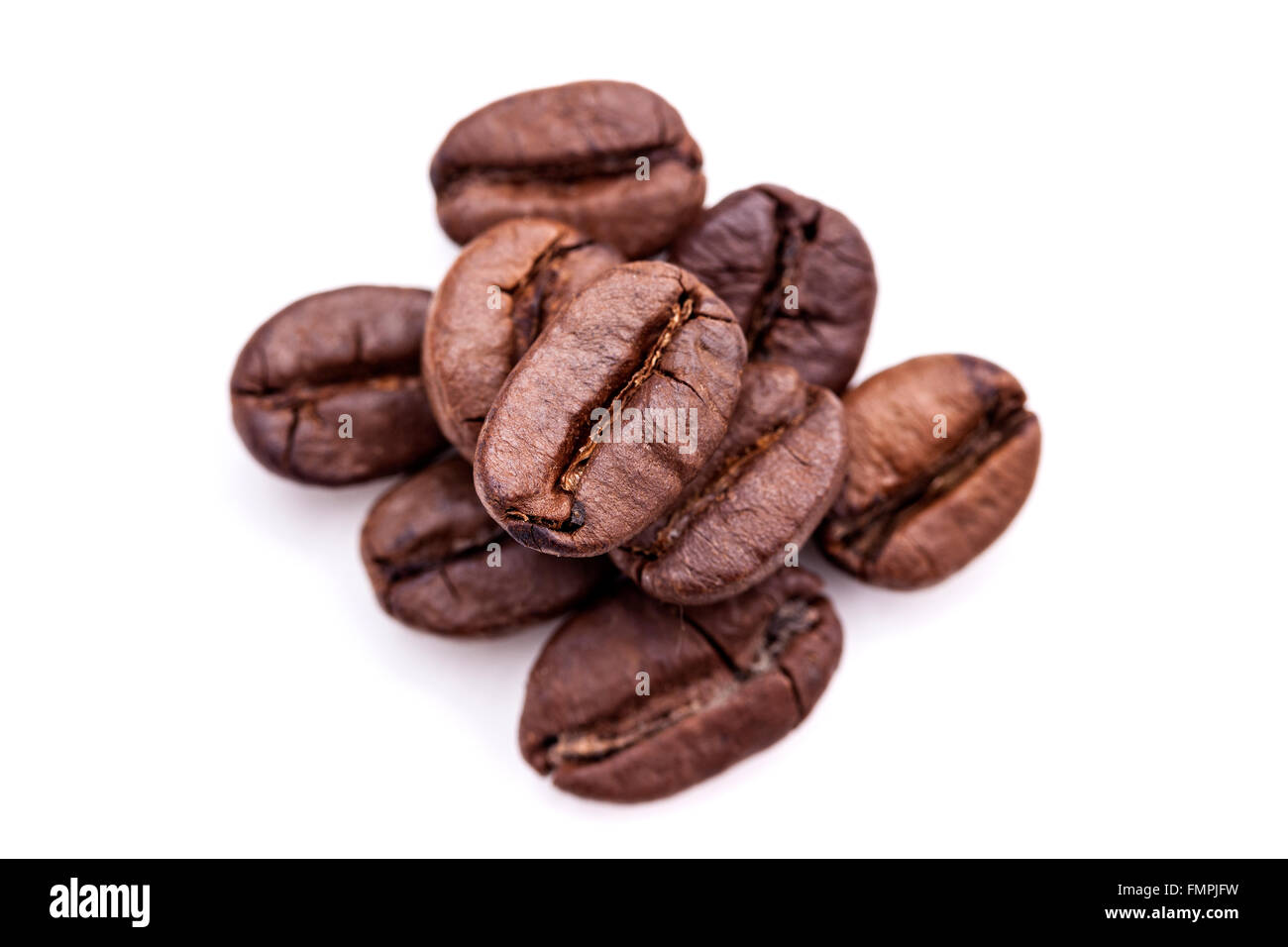 Heap of coffee beans isolated on white background Stock Photo - Alamy