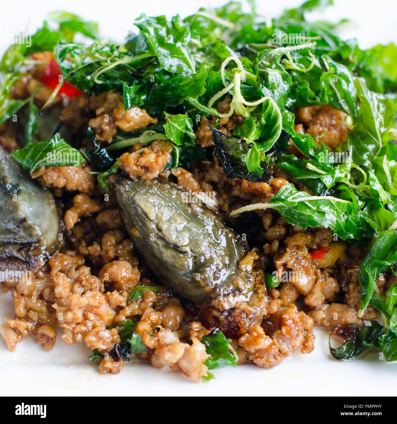 Fried century egg with crispy holy basil Stock Photo Alamy