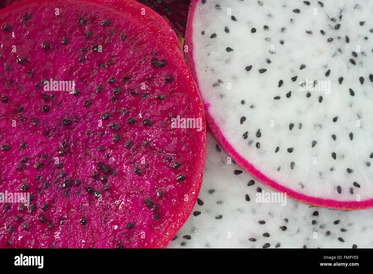sliced red dragon fruit as background Stock Photo